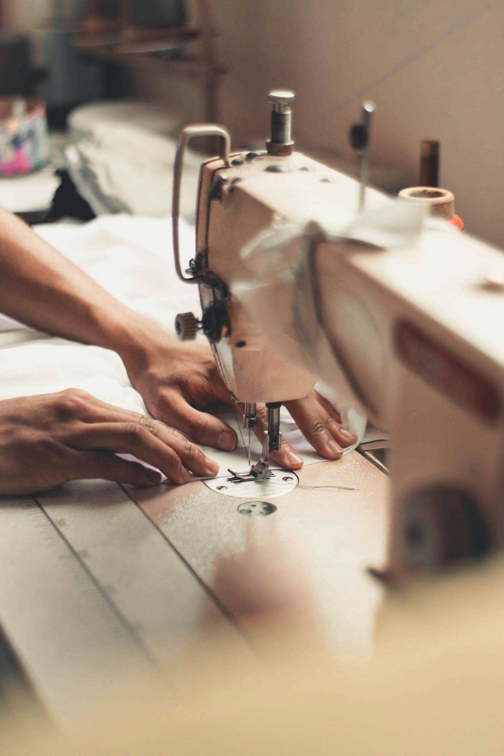 Person holding sewing machine